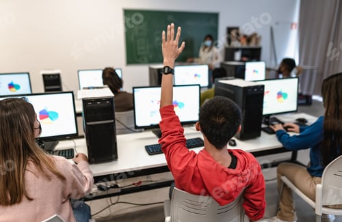 Preview: Young students listening a lesson in high school while wearing face mask during corona virus