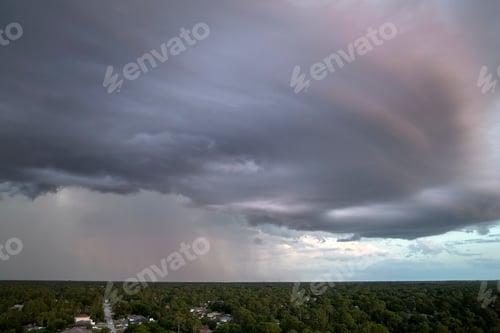 Preview: Landscape of dark ominous clouds forming on stormy sky during heavy thunderstorm