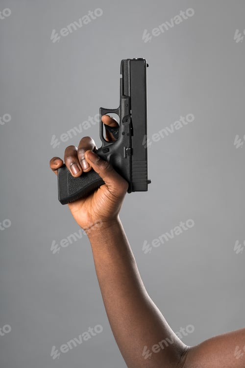 Preview: Black person showing handgun in hand