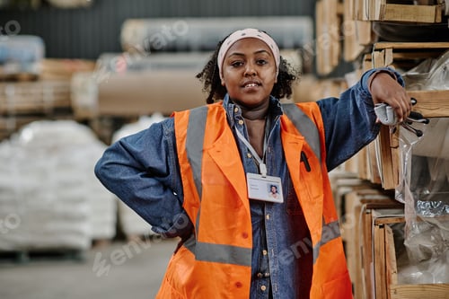 Preview: Woman working with loading of cargo in warehouse