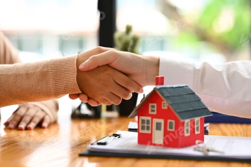 Preview: Realtor or landlord shaking hands with client after sign agreement or sale purchase contract.