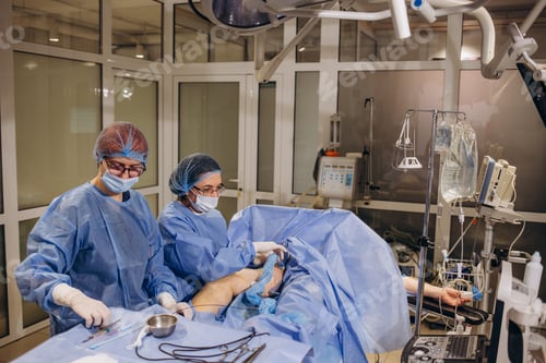 Preview: doctor and an assistant in the operating room for surgical venous vascular surgery clinic