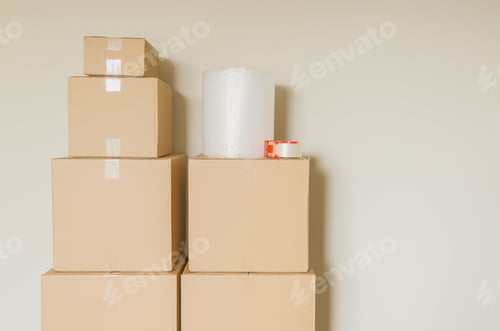 Preview: Variety of Packed Moving Boxes In Empty Room