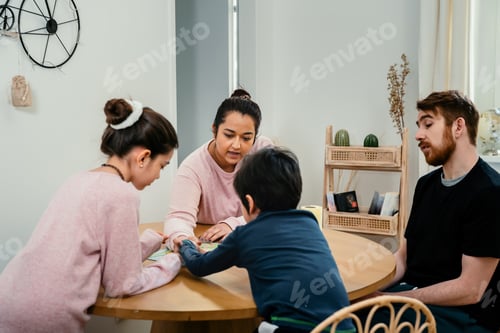 Preview: Mixed family playing at home with board game