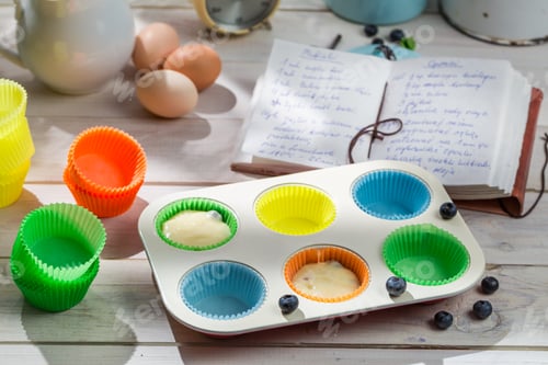 Preview: Colorful Muffin Liners with Recipe and Baking Ingredients