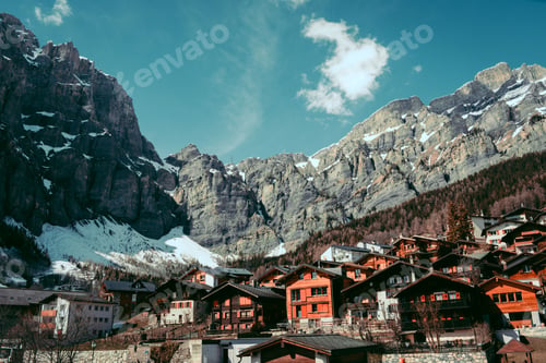 Preview: Scenery of houses under snowy rocks in Leukerbad, Switzerland