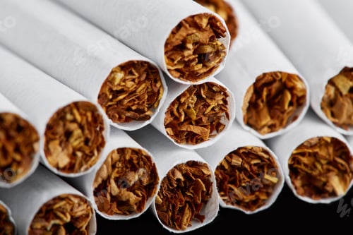 Preview: Cigarette Close Up Isolated On Blak Background. Drug Addiction. Tobacco Smoking. Cancer. Nicotine