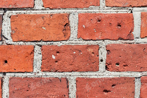Preview: Background of brick wall texture. Close-up of several old bricks vintage wall of old cathedral