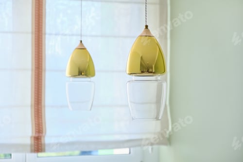 Preview: Interior home design, two modern gold-colored glass lamps over the dining table
