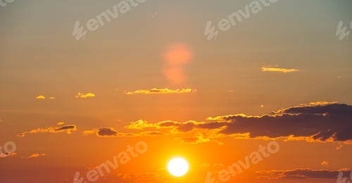 Preview: Bright colorful sunset sky with rays of setting sun and vivid dark clouds