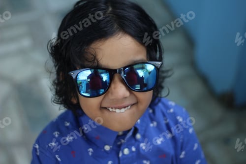 Preview: Naughty kid in stylish cool glasses
