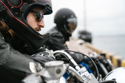 Preview: Photo of bearded brutal men bikers on bikes looking forward