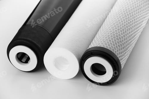 Preview: Cropped three filter cartridges for house water filtration system isolated. Foamed polypropylene