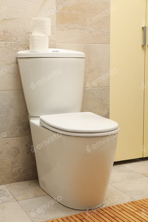 Preview: Toilet bowl in modern bathroom in light beige color