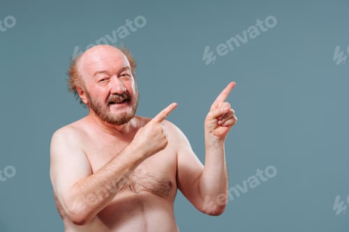 Preview: Front view elderly man stand from left looking to left pointing right index fingers of both hands.