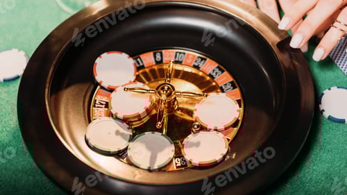 Preview: cropped image of girl playing roulette in casino