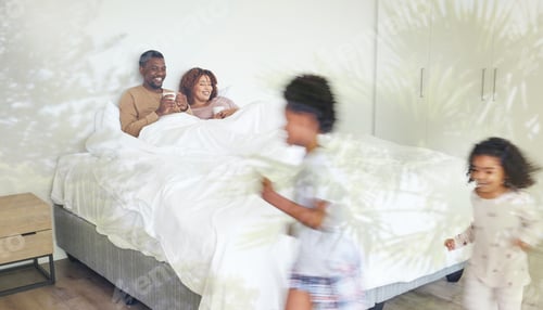 Preview: Relax, family and children being playful in the bedroom while their parents lay in bed with a cup o
