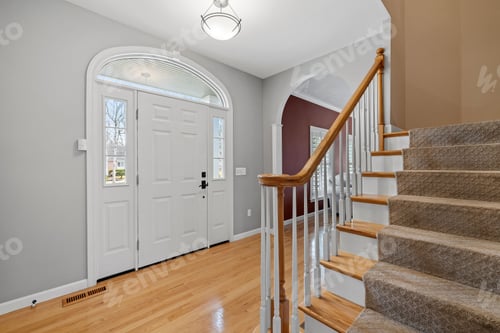 Preview: Closeup shot of the interior of a house entrance with a staircase on the side