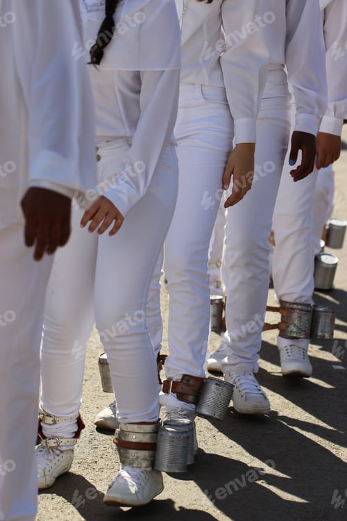 Preview: People in white pants and shirts standing in queue