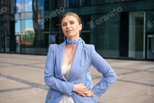 Preview: Portrait of a beautiful business woman on the background of an office building