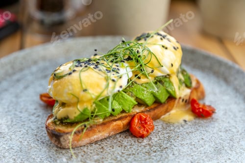 Preview: Avocado toast with poached eggs on top. Healthy breakfast option.