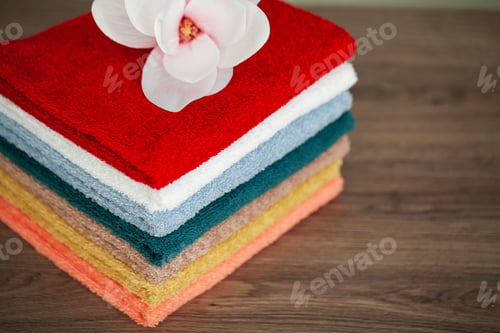 Preview: Stack colorful towels in bathroom on table