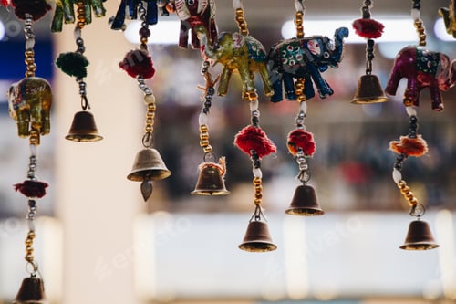 Preview: beautifully crafted wind chimes with bells hanging outside
