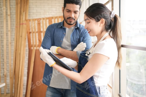 Preview: Carpenter workers using tablet consulting and brainstorming
