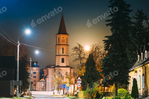 Preview: Ruzhany, Brest Region, Belarus. Rising Moon Above Trinity Church In Autumn Night. Famous Historic