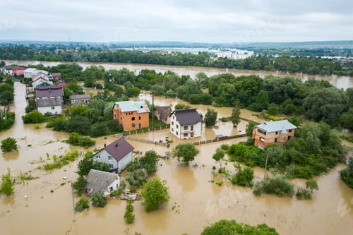 Preview: Aerial view of flooded houses with dirty water of Dnister river in Halych town, western Ukraine.