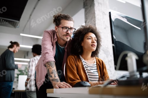 Preview: Programmers cooperating brainstorming at information technology company