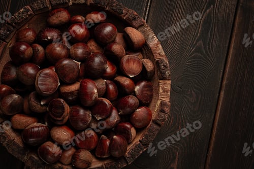 Preview: fresh chestnuts, in a wooden bowl, top view, no people,