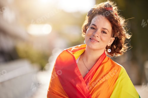Preview: Love, equality and woman with pride flag in city, happy non binary lifestyle of freedom, peace and