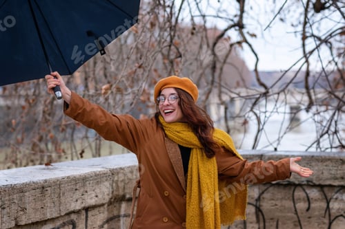 Preview: Smiling Woman Outdoors with Umbrella and Scarf
