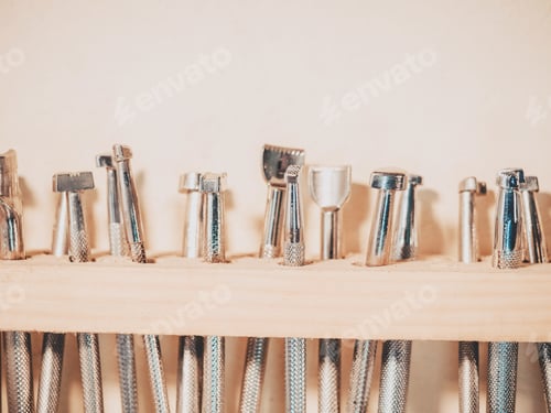 Preview: Carving stamps set tool on the shelf. Leather craft instruments for processing of natural materials