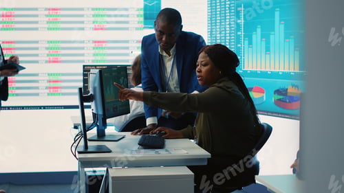 Preview: Business associates evaluating key performance indicators within the company