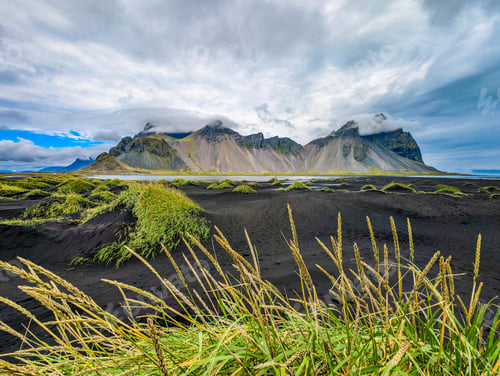 Preview: Vestrahorn mountain with black sand beach and Viking village, Iceland.