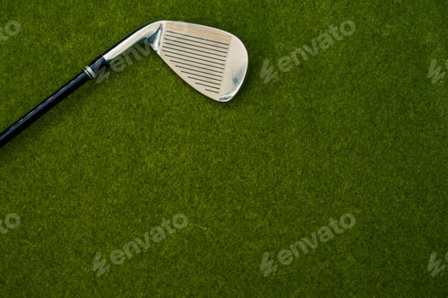 Preview: Closeup of a golf club on the grass with a copy space