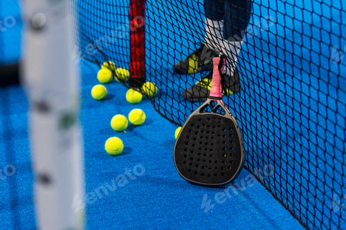 Preview: professional paddle tennis racket with natural lighting on blue background. Horizontal sport theme