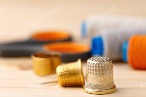 Preview: Threads and sewing accessories on wooden table
