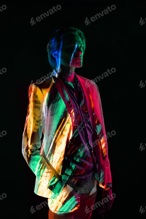 Preview: Androgynous man under bright illumination