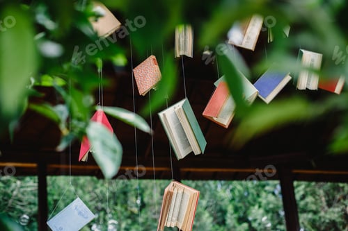 Preview: Old books hung with strings to encourage reading and learn about culture.