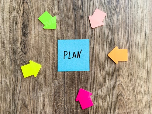 Preview: Paper stick with words plan on desk.