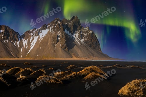 Preview: Northern lights at Vestrahorn Mountain and Stokksnes beach. Iceland