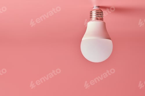 Preview: Light bulb, copy space. Energy saving minimal idea concept.Pink background.