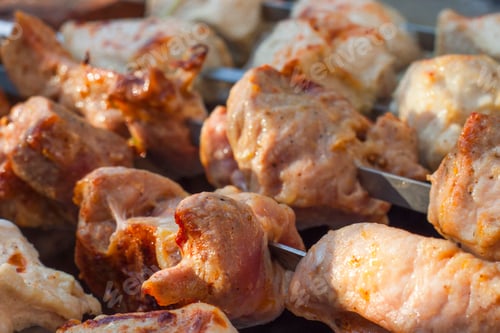 Preview: close-up of tasty shish kebabs on skewers