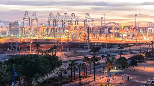 Preview: Cranes and containers at terminal harbor port at night