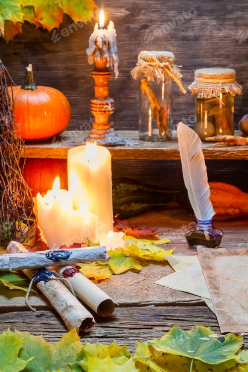Preview: Candle and old magic scrolls on the scribe table