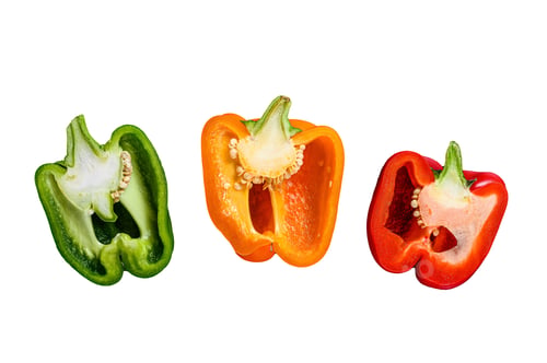 Preview: Three cut orange, green and red sweet peppers. Isolated on white background.