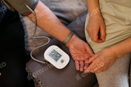 Preview: Health monitoring takes place at home during a routine check for blood pressure readings